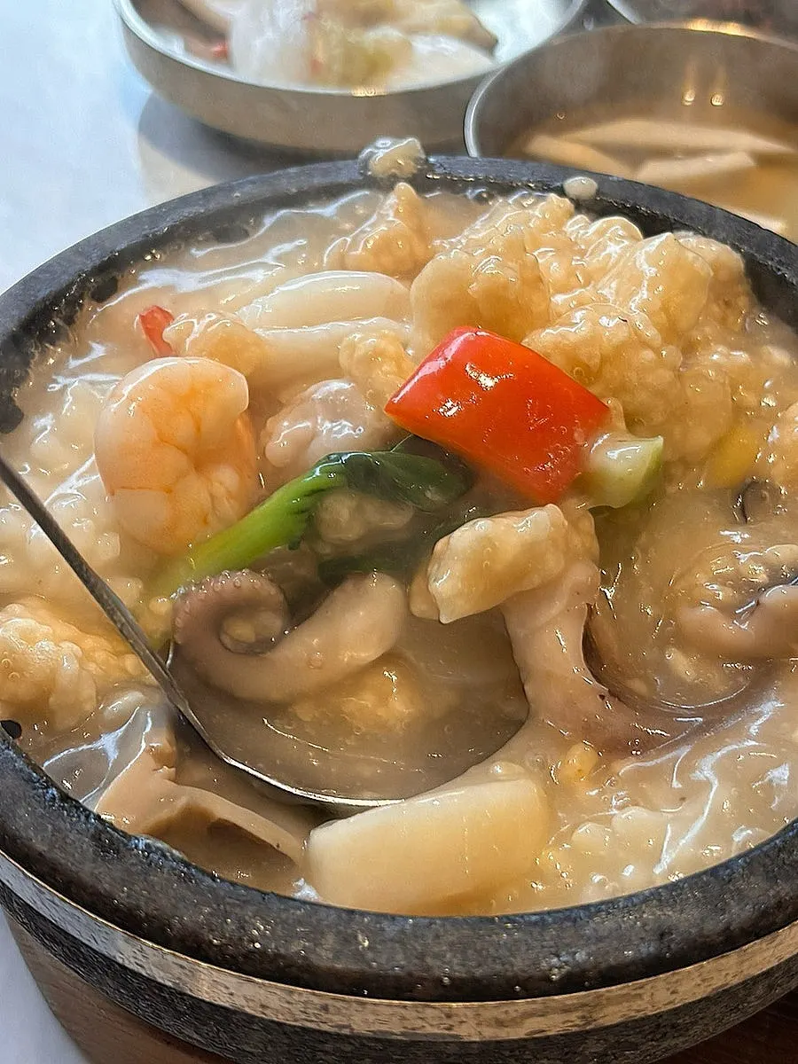 Close-up of the seafood nurungjitang in the stone pot
