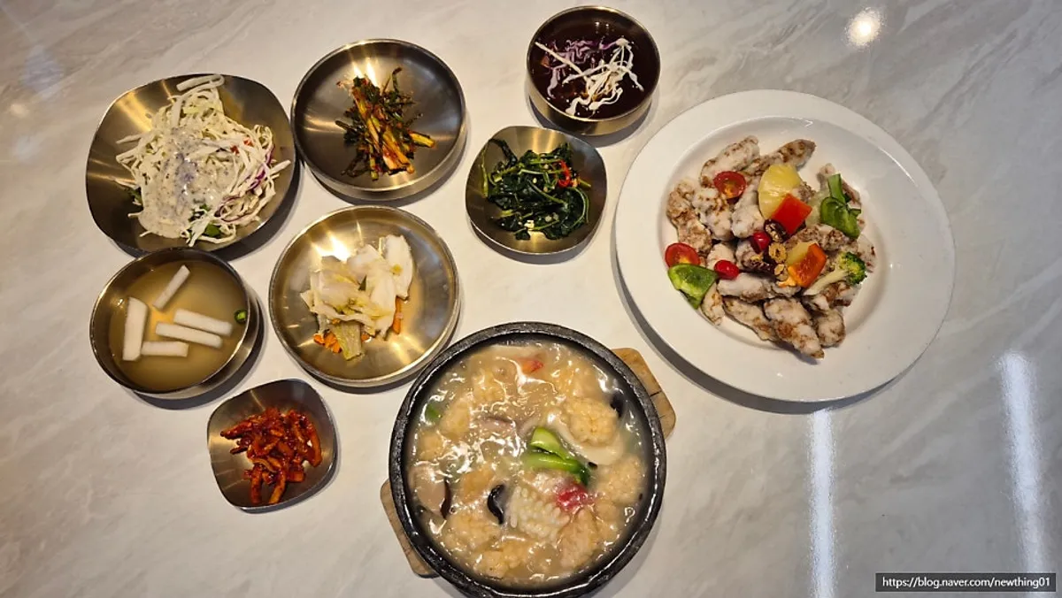 Table setting with seafood nurungjitang and fresh tenderloin glutinous sweet-and-sour pork