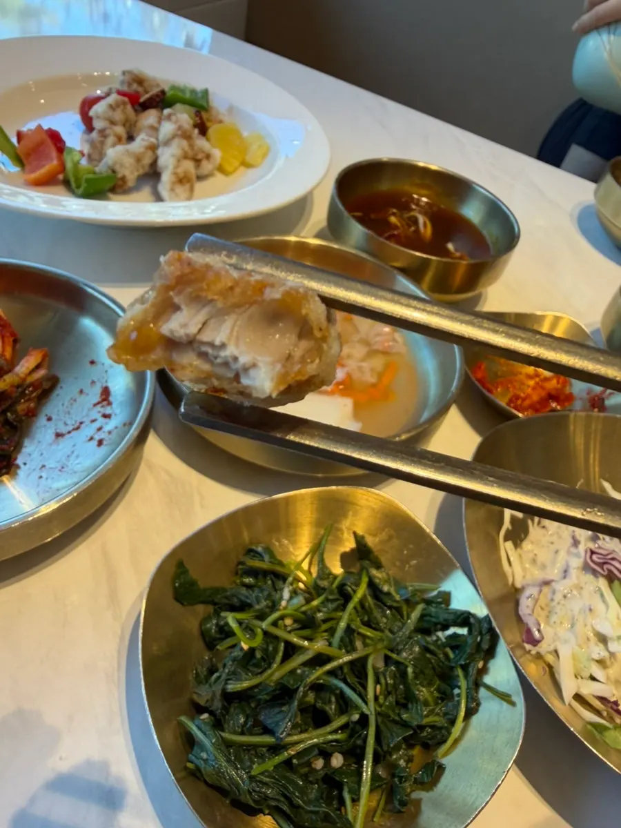 A sauce-dipped piece of tangsuyuk