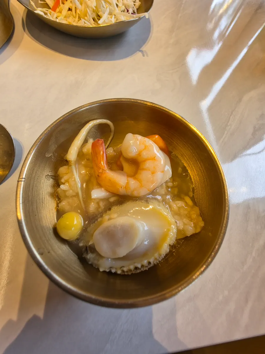 A spoonful of rice crust soaked in broth