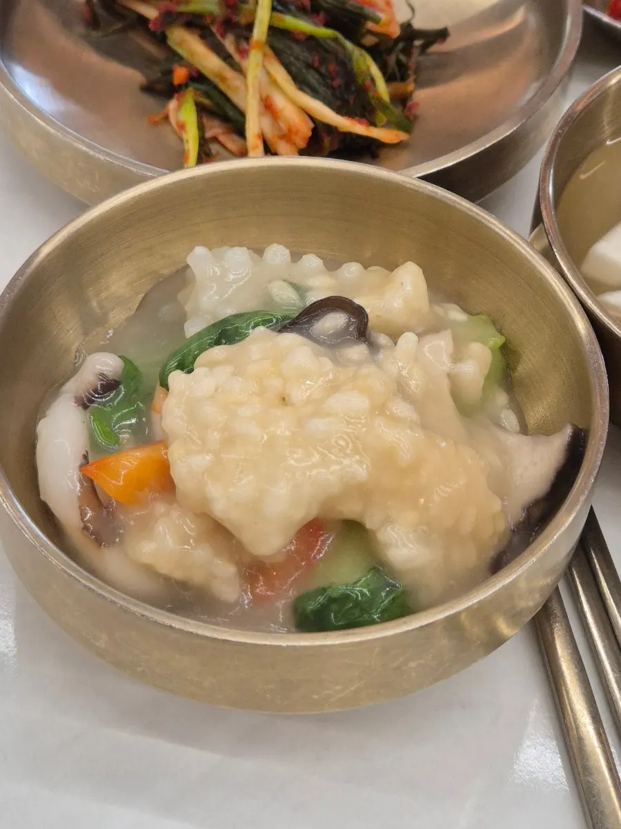 Shrimp and squid visible in the seafood nurungjitang
