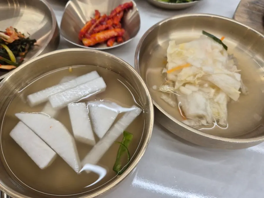 Containers of side dishes at the self-serve bar