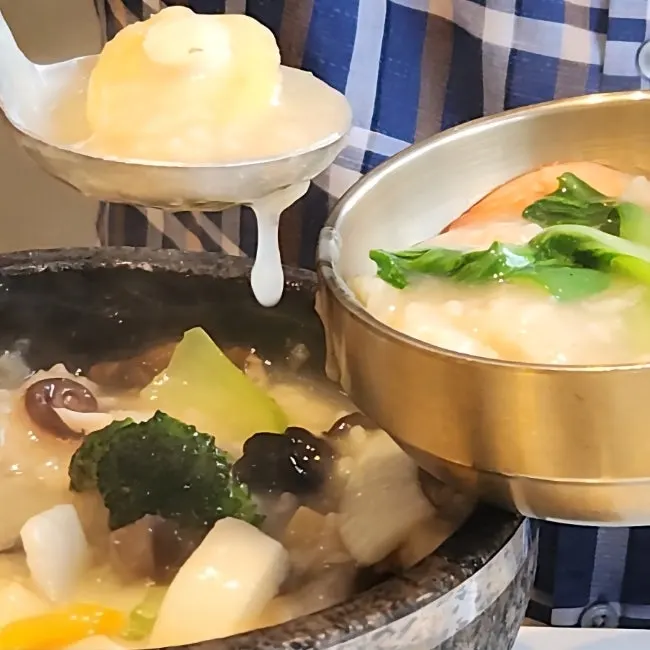 Seafood abalone nurungjitang bubbling in a stone pot