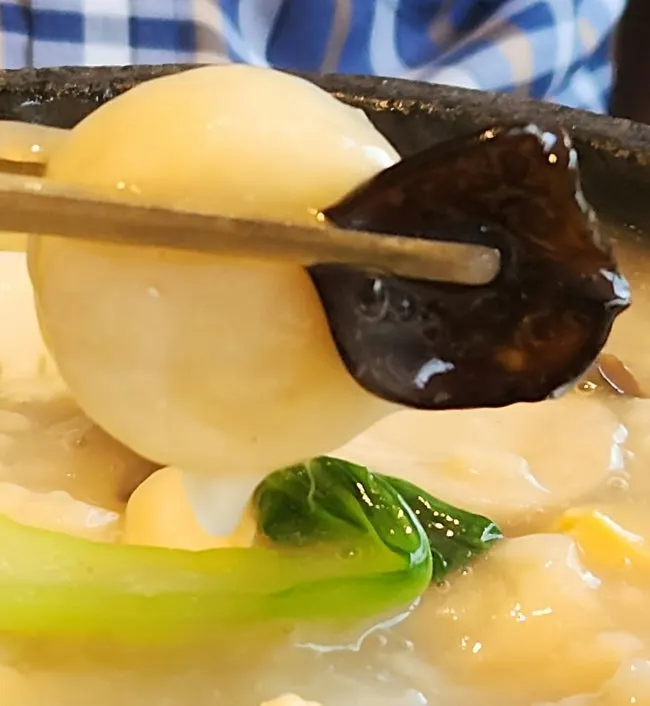 Seafood abalone nurungjitang showing shrimp and squid
