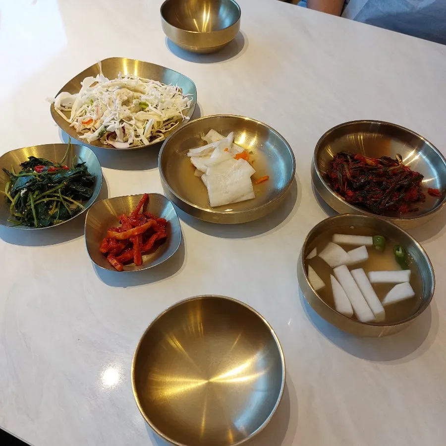 Table setting and side dishes with a Korean restaurant feel