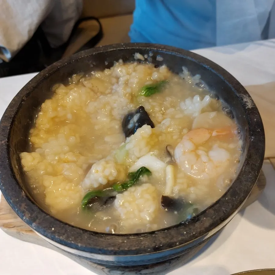 Seafood abalone nurungjitang topped with abalone and ginseng