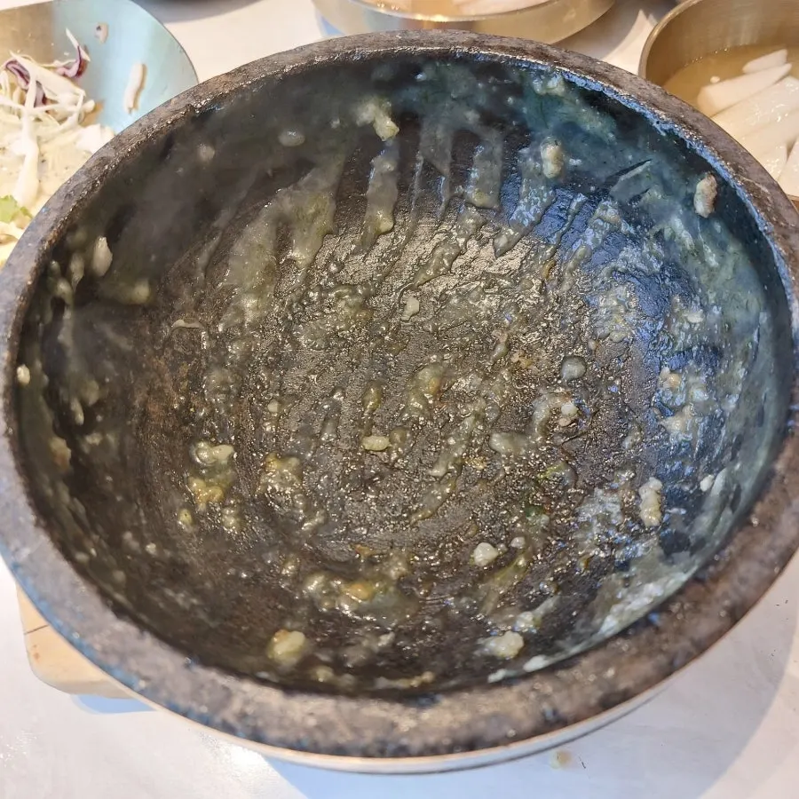 A bowl of stone pot nurungjitang still hot to the last spoonful
