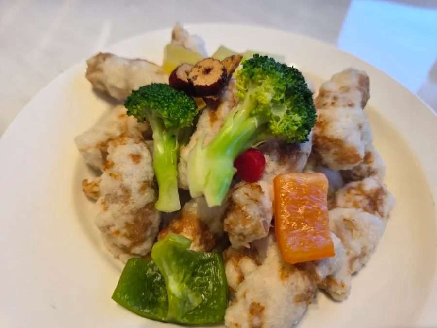 Table with seafood abalone nurungjitang and fresh-tenderloin sweet and sour pork