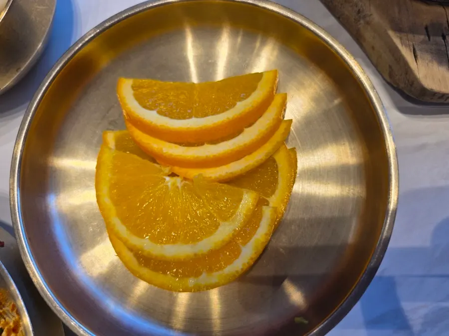 A plate of orange served for dessert