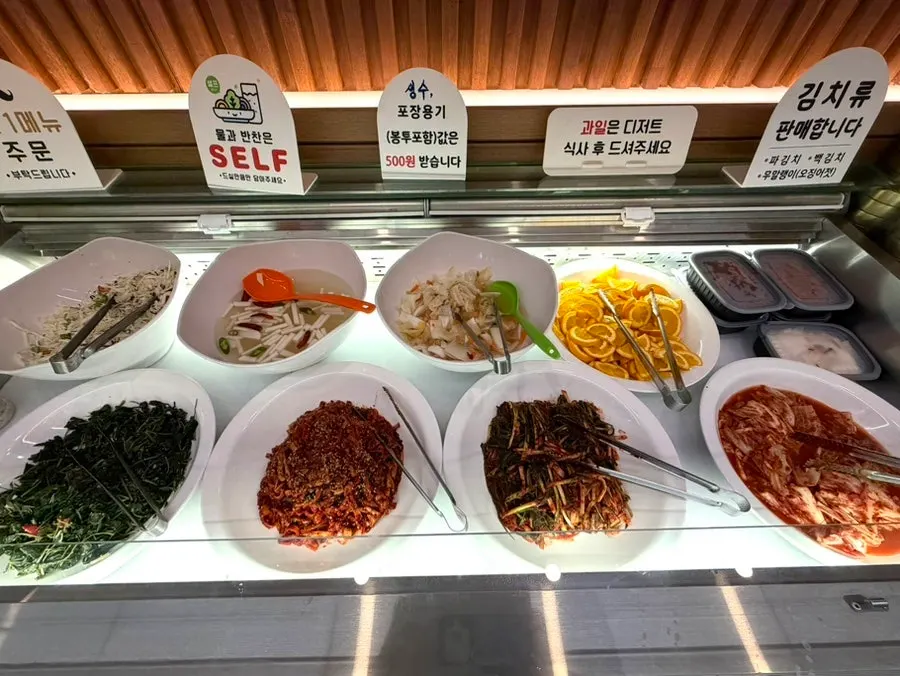 Various side dishes laid out at the self-serve bar
