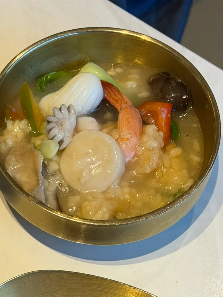 Broth of the seafood nurungjitang packed with seafood