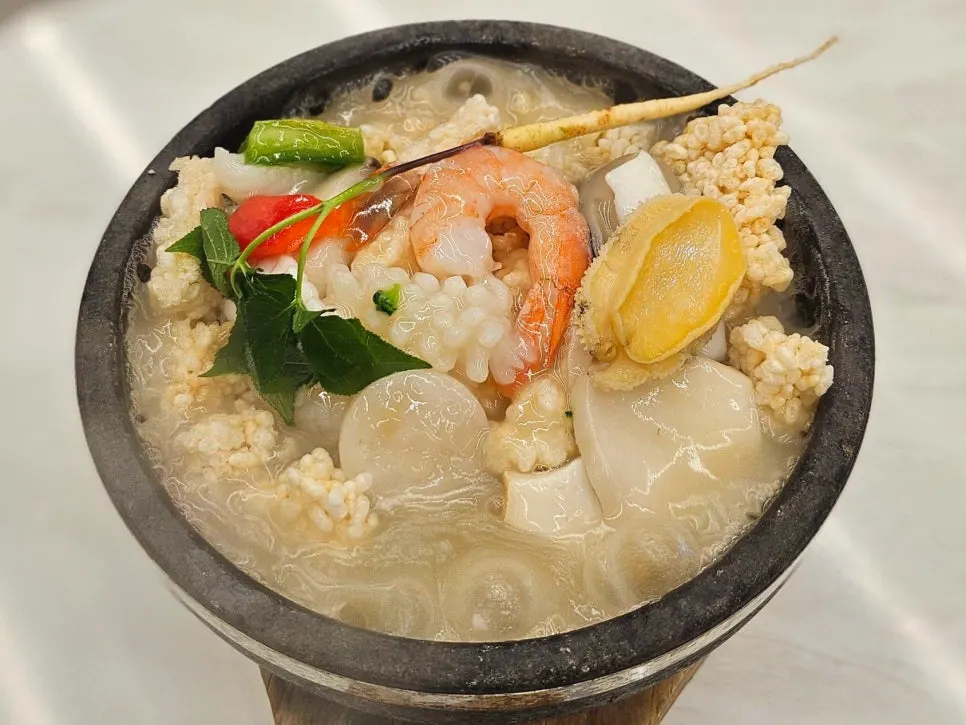 Seafood abalone nurungjitang in a stone pot