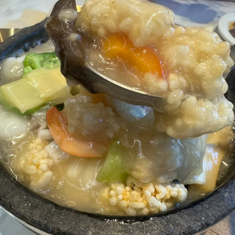 Broth of the seafood nurungjitang packed with seafood