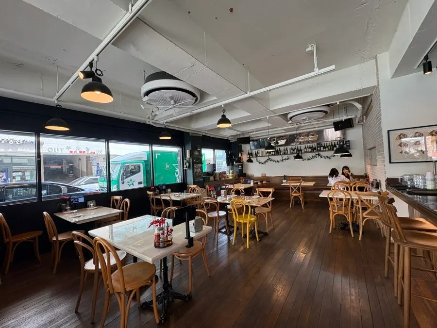 Interior seating, mostly tables for four