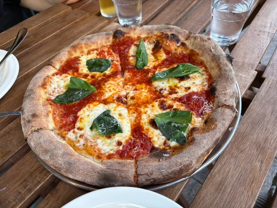 A whole New York margherita wood-fired pizza