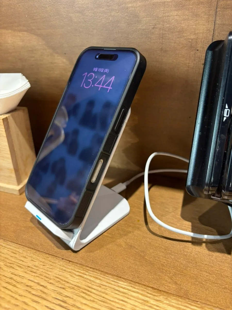 Table with a wireless charging phone stand