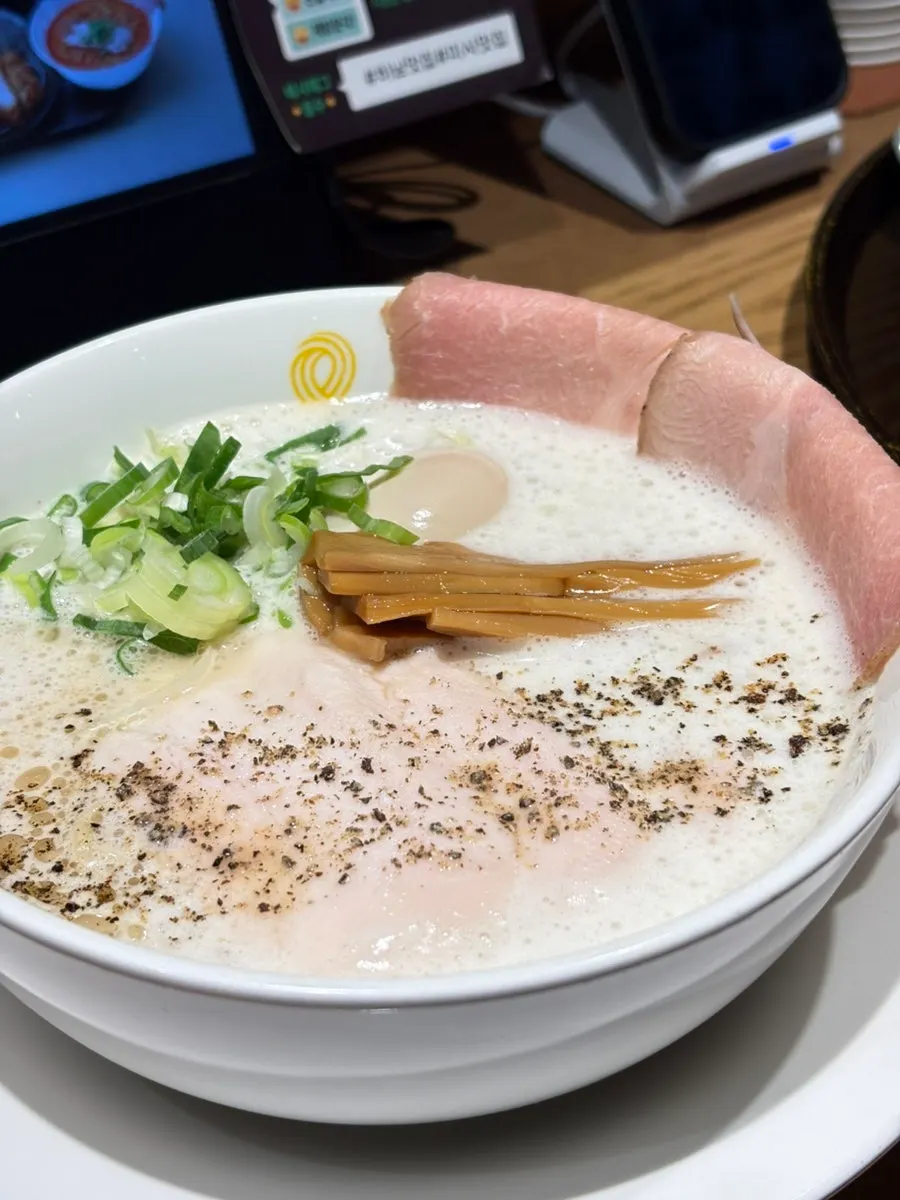 Whole-wheat handmade fresh noodles being lifted up