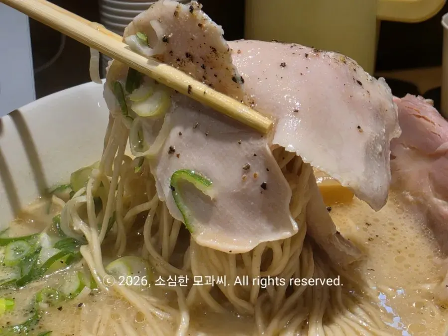 Close-up of sous vide pork neck char siu topping