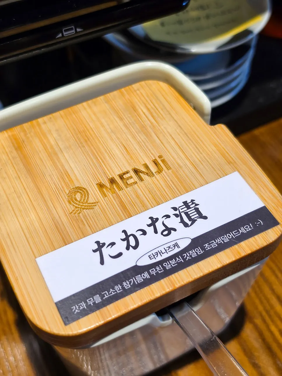 Self-serve bar with homemade ajihen chili oil and pepper