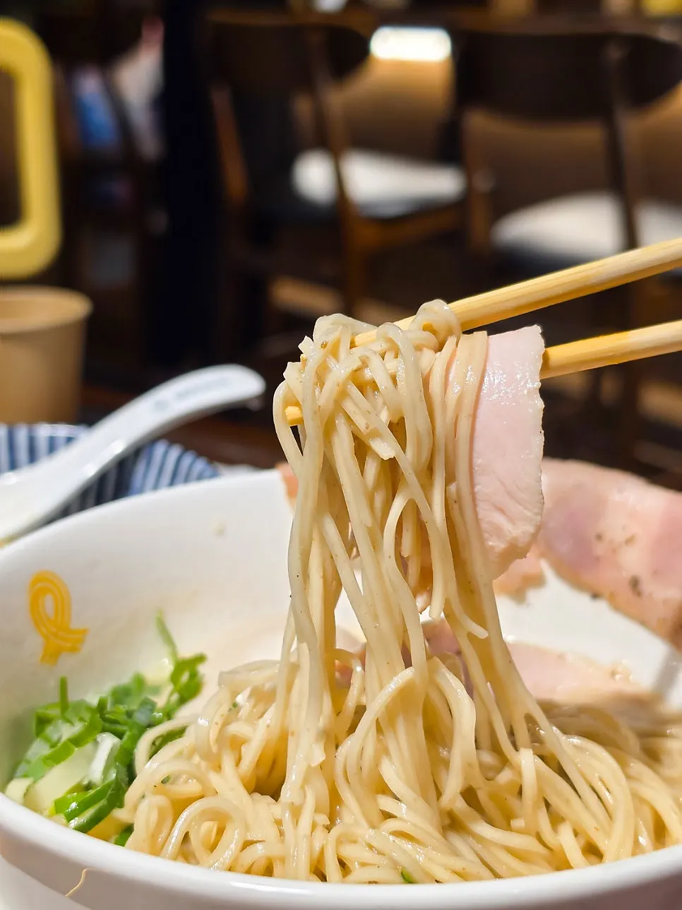 Tori paitan ramen topped with char siu and chicken breast