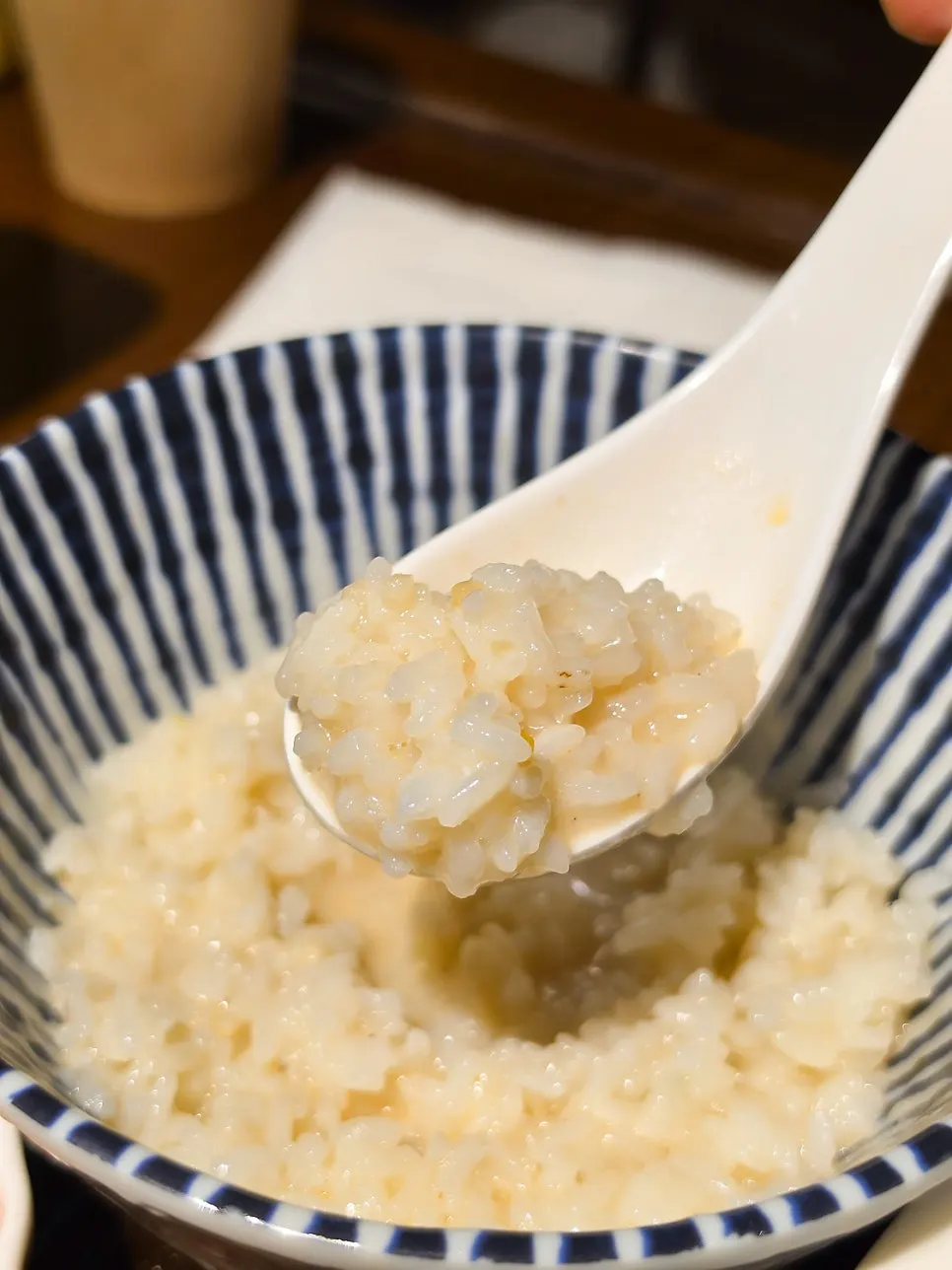 Mini rice bowl with chicken broth poured over it