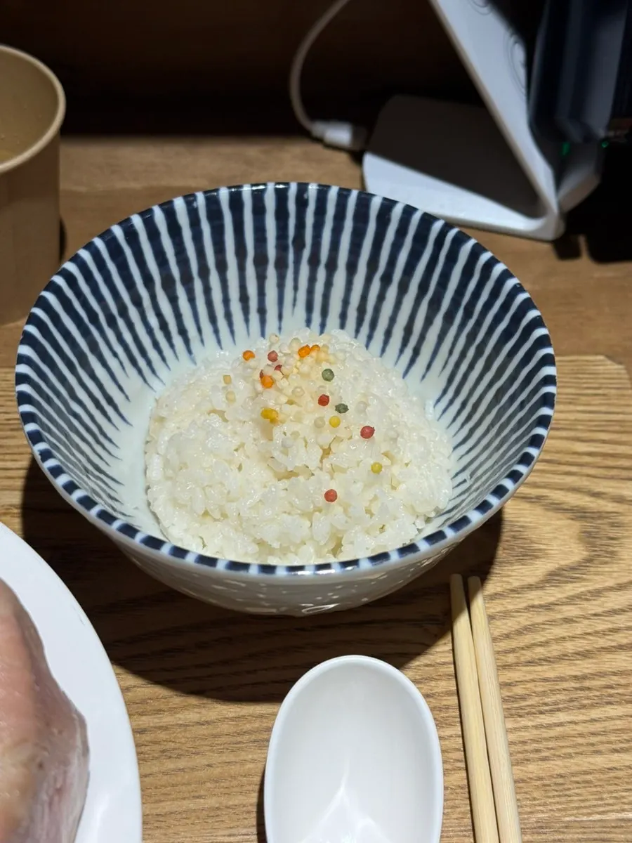Ramen noodles lifted after mixing into the broth