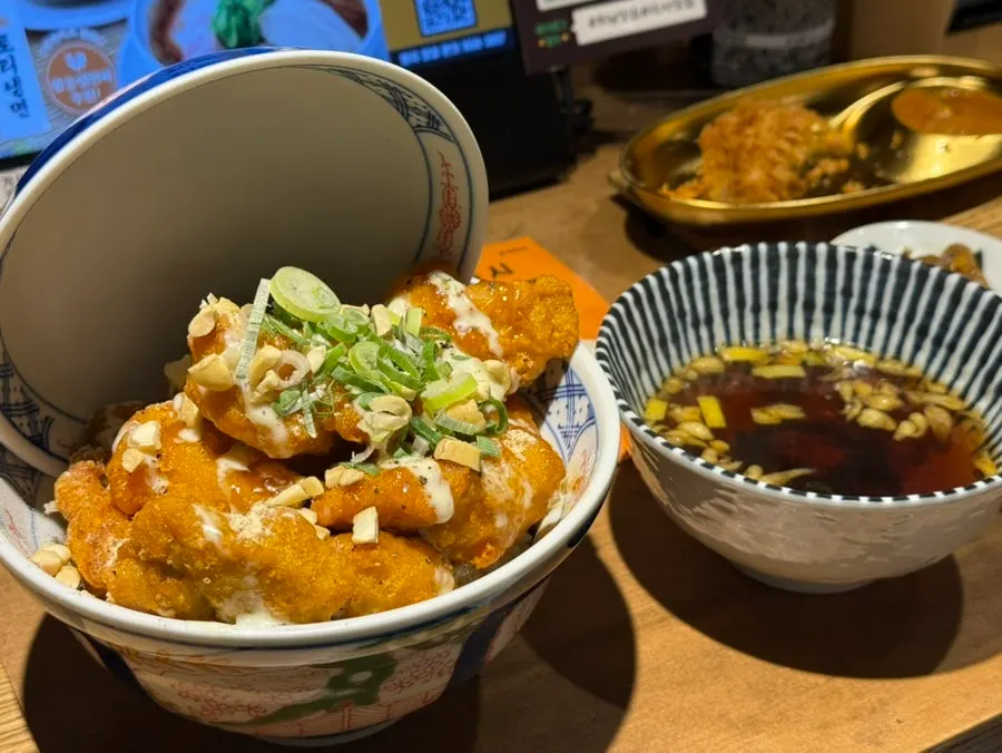 Table set with ramen and side dishes
