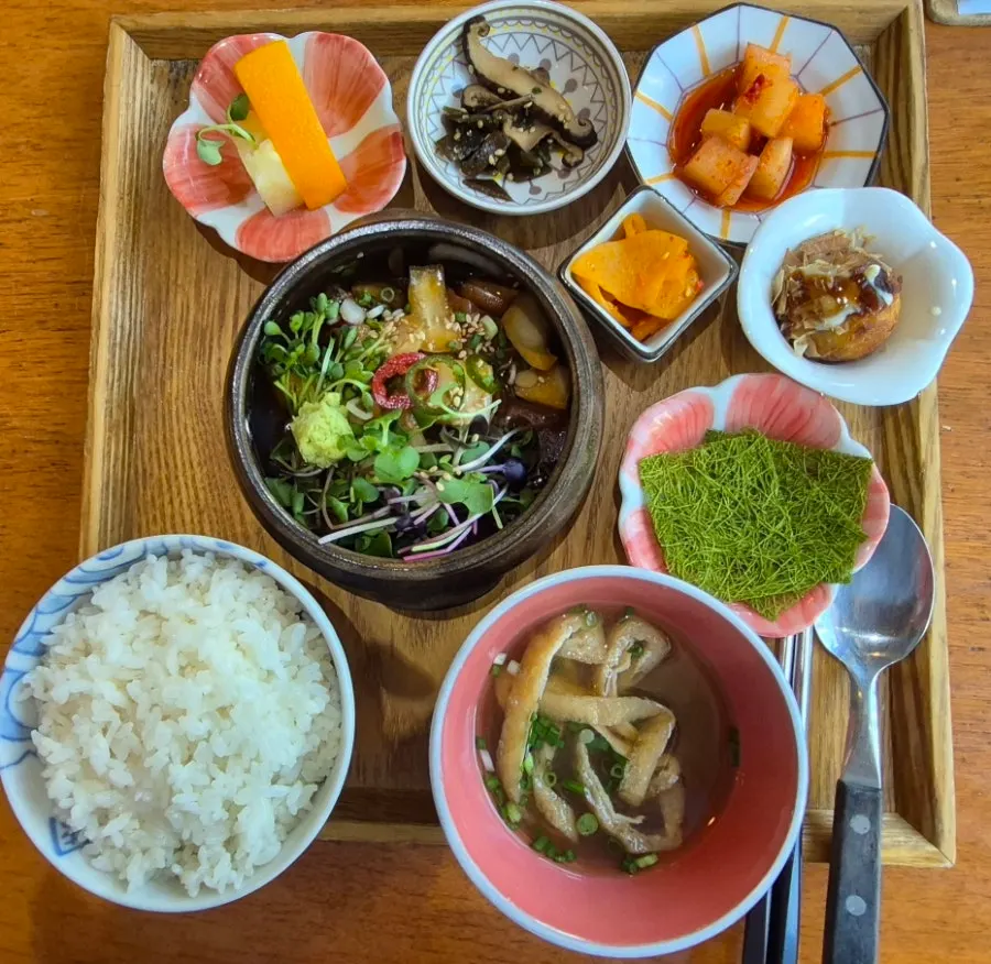 Aging jars for the yuzu salmon jang displayed under the showcase
