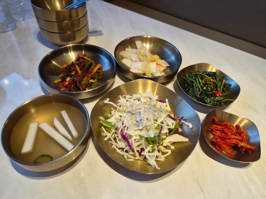 Basic side dishes served in brass bowls
