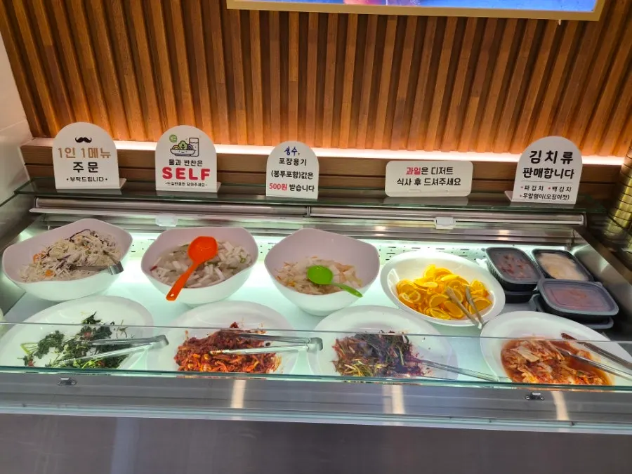 Self-serve corner stocked with side dishes
