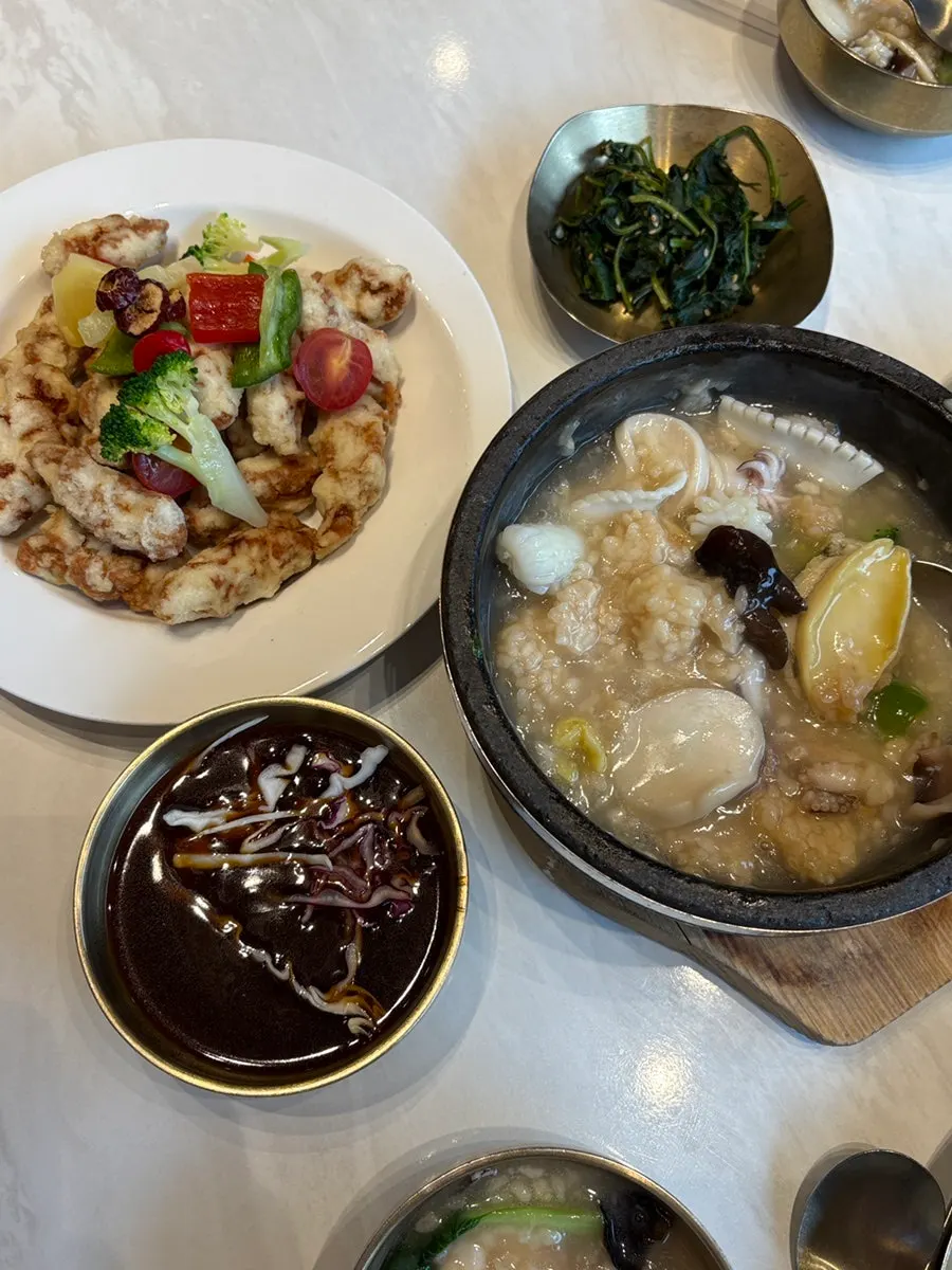 Seafood nurungjitang served with a small side plate