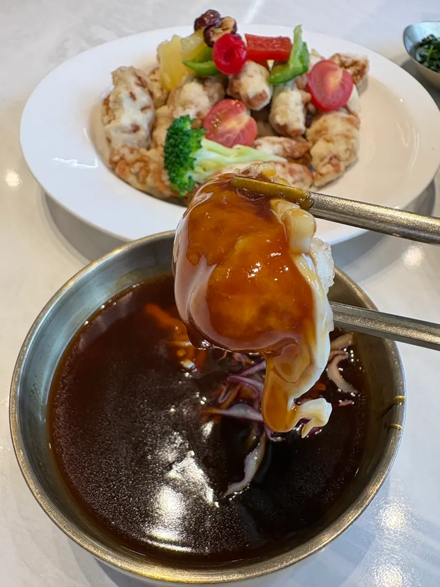 A spread of seafood nurungjitang and tangsuyuk together