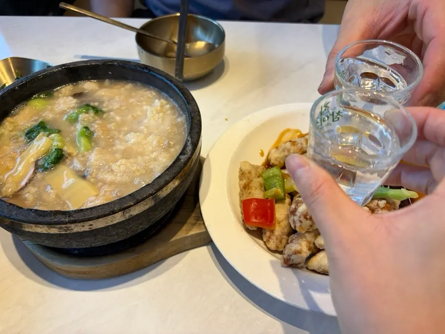 Rice soup topped with green onion kimchi