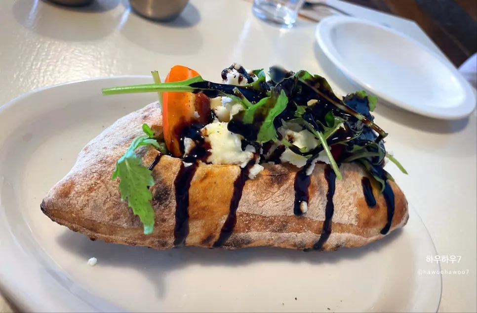 Handmade olive pesto Italian arugula pizza boat