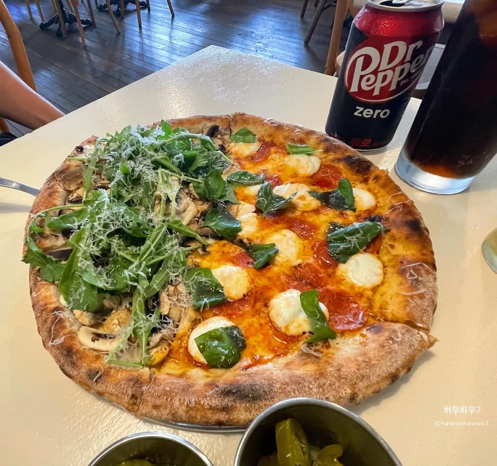 Half-and-half wood-fired pizza with ricotta honey pepperoni and truffle mushroom