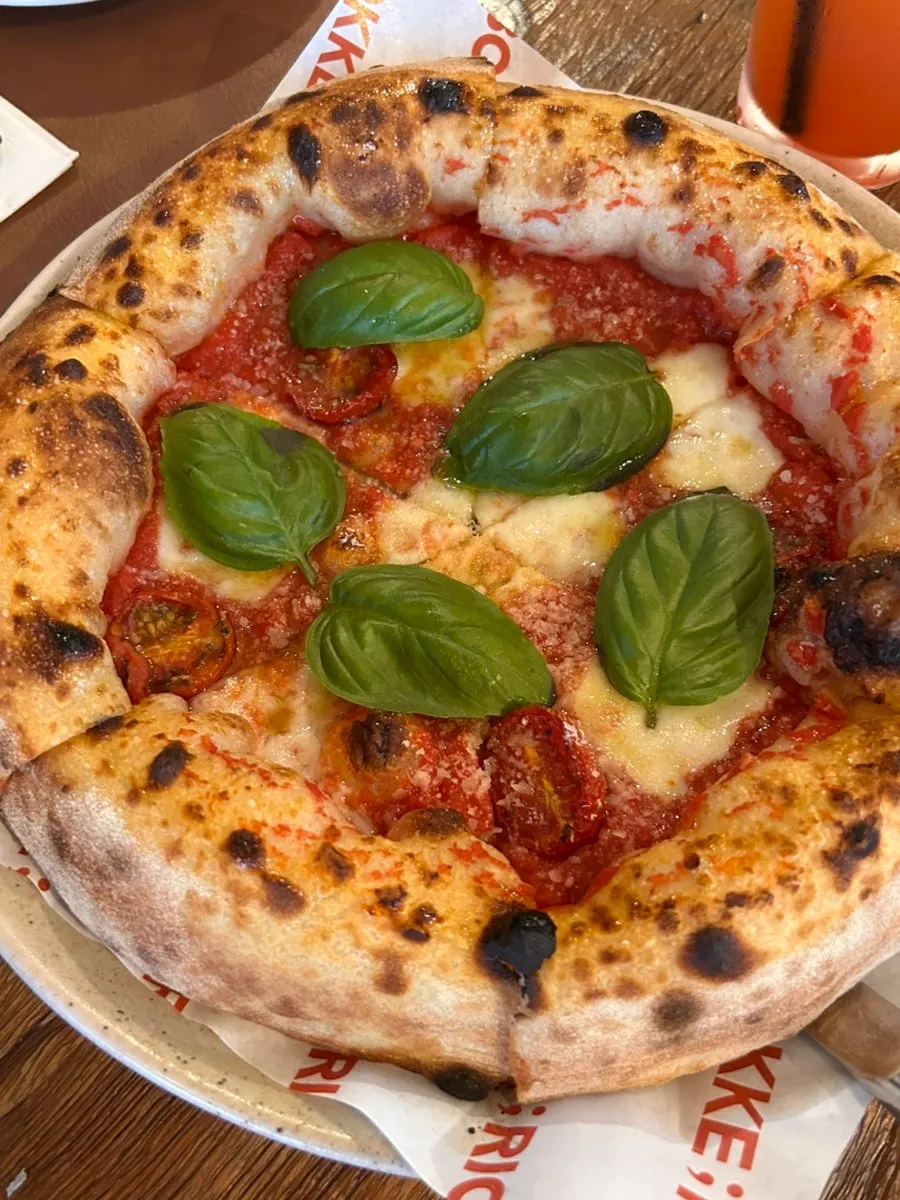 Close-up of a slice of margherita pizza