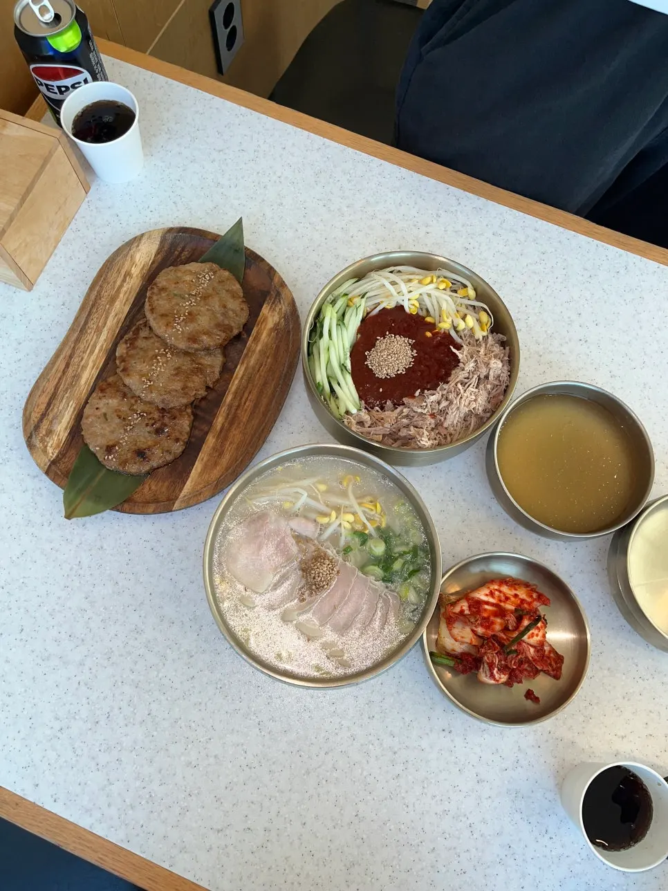 Table set with noodles and tteokgalbi ordered for two