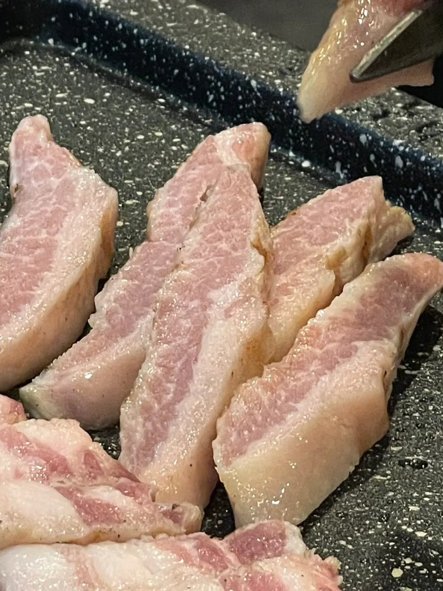 Pork belly grilling on the tabletop grill