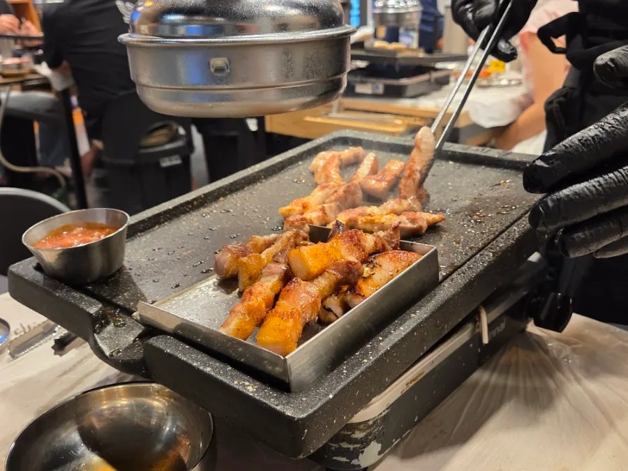 Meat sizzling as it cooks