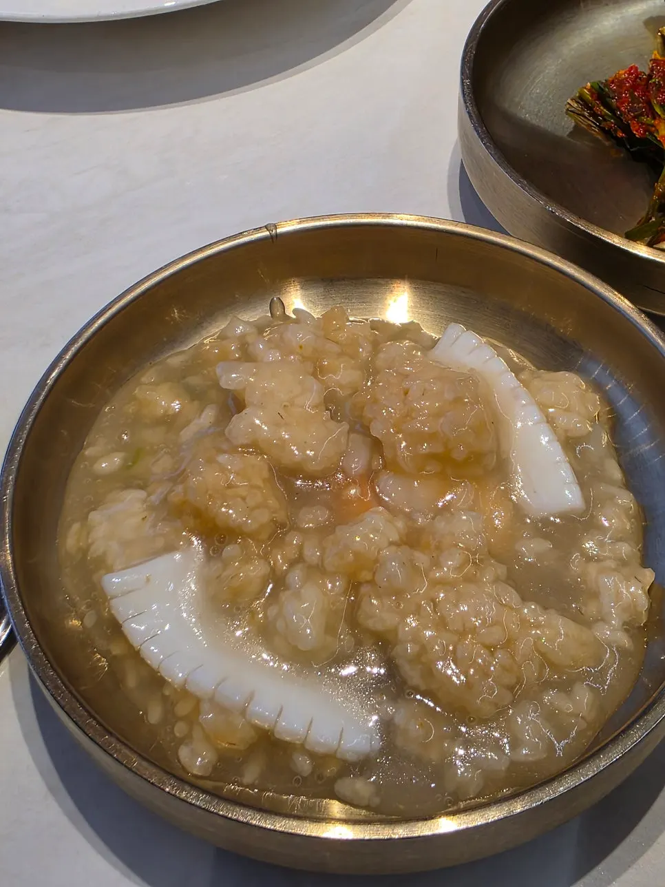 A spoonful of nurungjitang paired with tangsuyuk