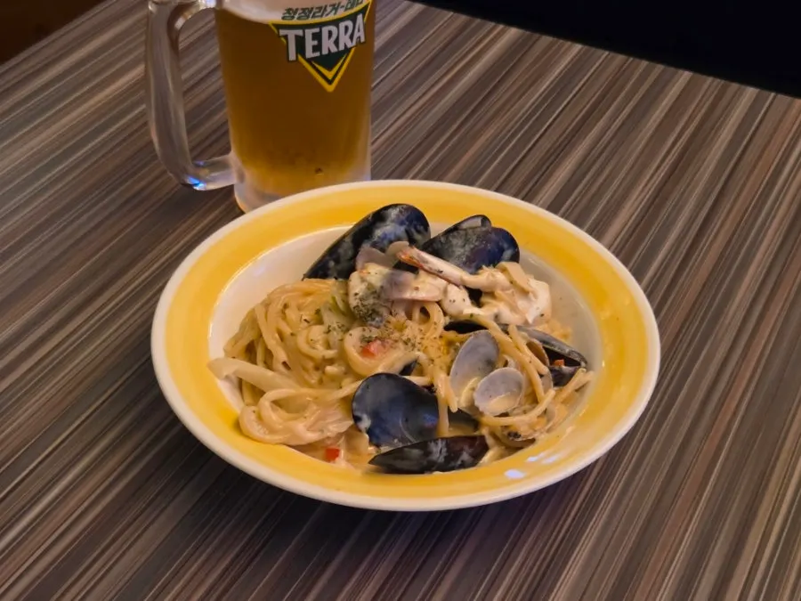 A plate of Hanamato's seafood cream pasta