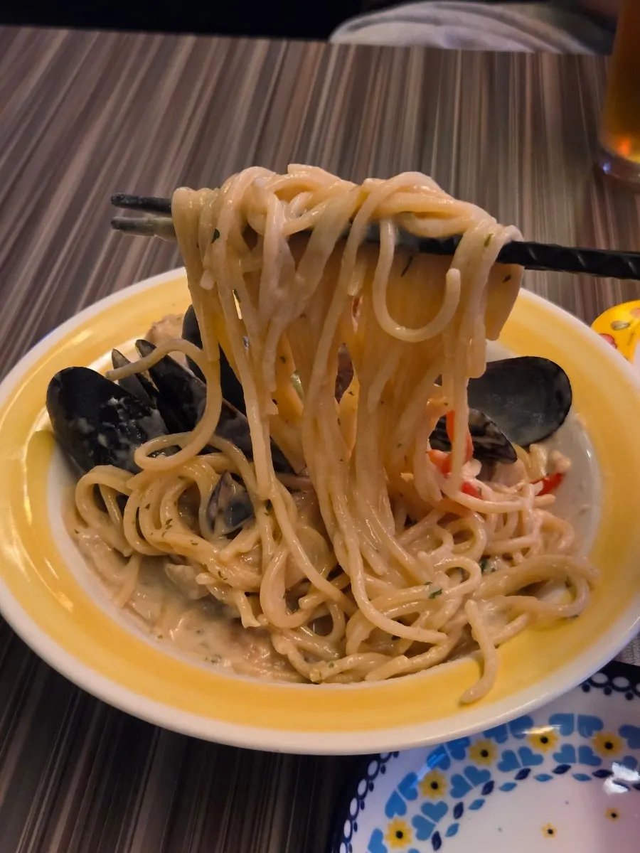 Close-up of the thick cream sauce on the seafood cream pasta