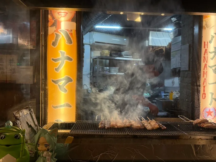 Skewer grill station seen from the counter seats at Hanamato
