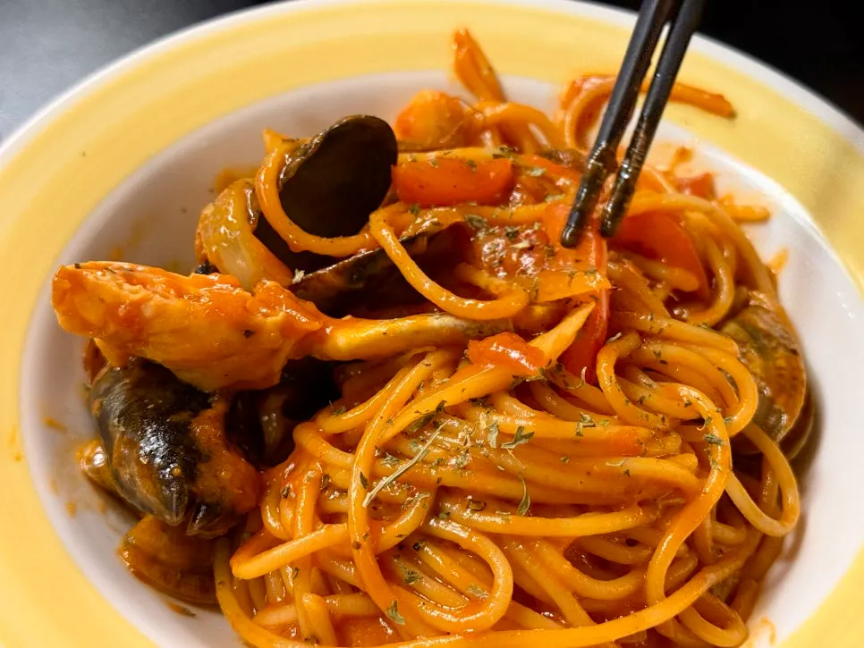 Sapporo bisque pasta topped with shrimp and mussels