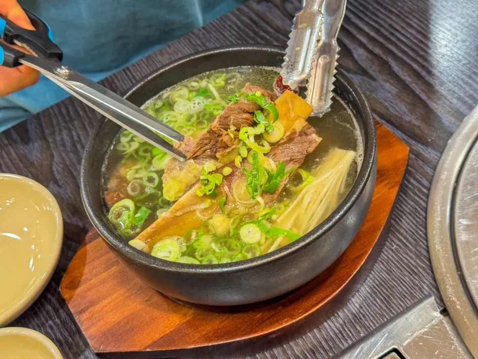 Table with wang galbitang and samgyetang served together