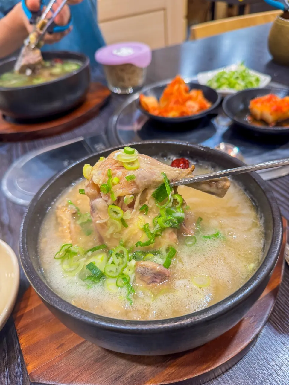 Picking rib meat off and eating it with the broth
