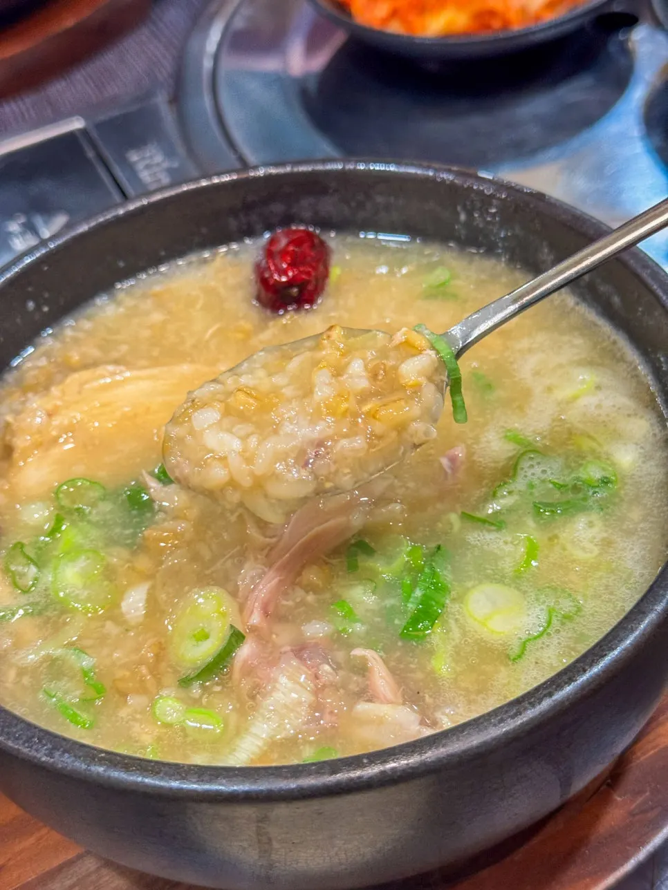 A bowl of galbitang with rice mixed in