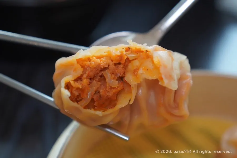 Cross-section of kimchi mandu showing the packed filling