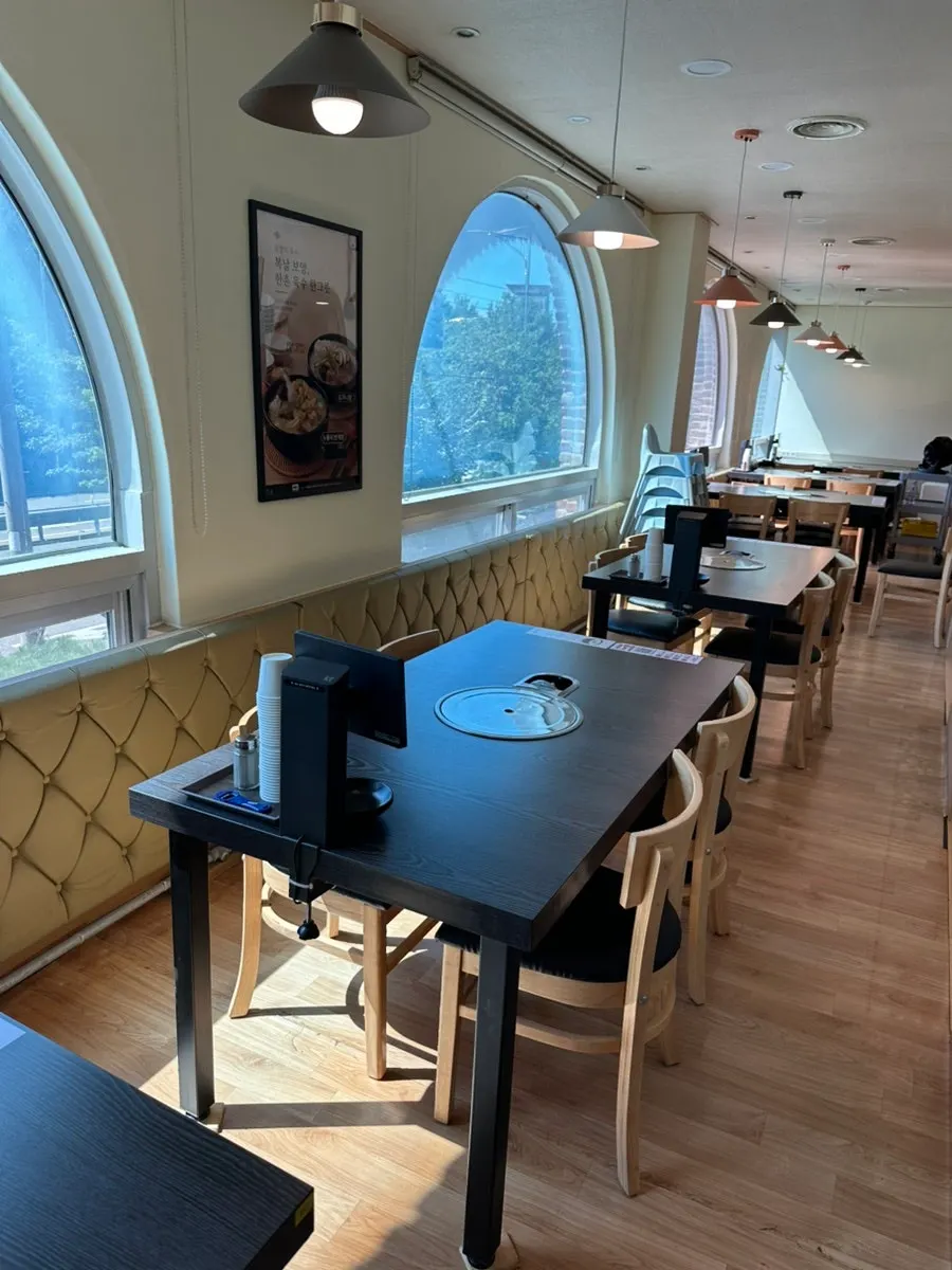 Cushioned sofa seating and multiple tables