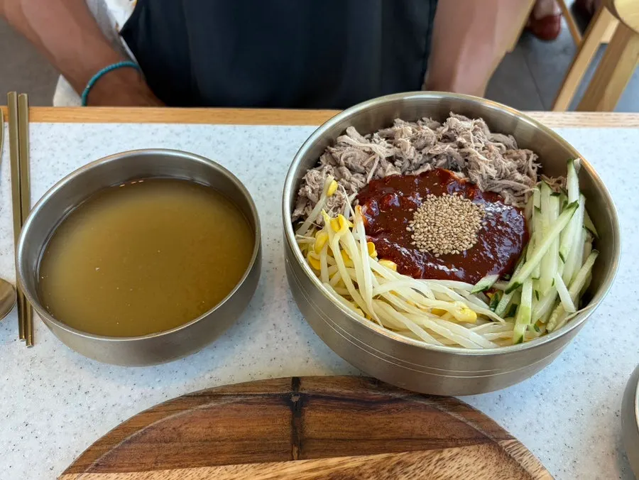 A bite of pork with kimchi